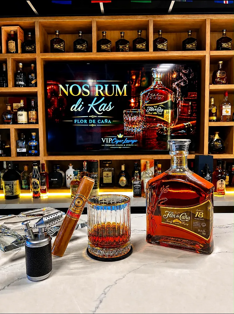 Flor de Caña 18 rum poured beside a premium cigar on the bar